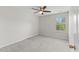 Cozy bedroom features soft carpeting, a ceiling fan, and a window for natural light at 1705 Bodwin Ln, Apex, NC 27502