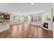 Open living space features a fireplace, and access to a screened-in porch at 1705 Bodwin Ln, Apex, NC 27502