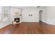 Spacious living room with hardwood floors and a cozy fireplace at 1705 Bodwin Ln, Apex, NC 27502
