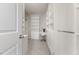 Organized walk-in closet with built-in shelves, drawers, and a desk area at 1705 Bodwin Ln, Apex, NC 27502
