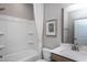 Bright bathroom with white bathtub, shower, toilet, and sink at 181 Churchill Way, Clayton, NC 27520
