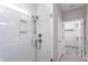 Walk-in shower features white subway tile and a glass door, adding modern style to the bathroom at 181 Churchill Way, Clayton, NC 27520