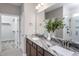 Bathroom featuring double sinks, granite counters, and a walk-in shower at 181 Churchill Way, Clayton, NC 27520