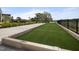 Bocce ball court with a fenced in view of the lake at 181 Churchill Way, Clayton, NC 27520