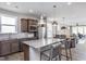 Modern kitchen featuring a large center island, stainless steel appliances, and stylish pendant lighting at 181 Churchill Way, Clayton, NC 27520