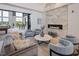 Cozy living room with fireplace, comfortable seating, and large windows with scenic view at 181 Churchill Way, Clayton, NC 27520