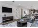 A modern living room featuring stylish decor, a flatscreen TV, and a comfortable gray sofa at 181 Churchill Way, Clayton, NC 27520