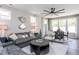 Cozy living room showcasing a comfortable sofa, stylish decor, and lots of natural light at 181 Churchill Way, Clayton, NC 27520