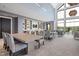 Inviting lounge area with dining tables, comfortable chairs, and stylish built-in shelving at 181 Churchill Way, Clayton, NC 27520