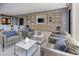 Relaxing lounge area with comfortable seating, built-in shelving, and stylish decor at 181 Churchill Way, Clayton, NC 27520