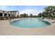 Community pool with zero entry access, lounge chairs, and mature trees on a sunny summer day at 181 Churchill Way, Clayton, NC 27520