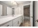 Bright bathroom features a white vanity with quartz countertop and modern fixtures at 190 Whistlers Cv, Louisburg, NC 27549
