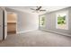 Large bedroom provides lots of natural light and has neutral-colored walls and carpet at 190 Whistlers Cv, Louisburg, NC 27549
