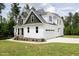 Lovely two-story home features a white exterior with a two-car garage at 190 Whistlers Cv, Louisburg, NC 27549