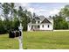 Beautiful two-story home with a well-manicured lawn and charming mailbox at 190 Whistlers Cv, Louisburg, NC 27549