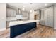 New kitchen with grey cabinetry, stainless appliances, white countertops, large island, and wood-look flooring at 190 Whistlers Cv, Louisburg, NC 27549