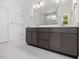 Bathroom vanity featuring shaker cabinets, gold hardware, and a quartz countertop at 200 Whistlers Cv, Louisburg, NC 27549