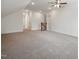 Large bonus room with neutral carpeting, ceiling fan, and multiple access points at 200 Whistlers Cv, Louisburg, NC 27549