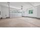Spacious and well-lit two car garage with ample room for parking and storage at 200 Whistlers Cv, Louisburg, NC 27549