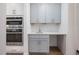 Charming kitchenette featuring gray cabinets, modern stainless-steel appliances and ample counter space at 200 Whistlers Cv, Louisburg, NC 27549