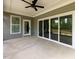 Covered patio with ceiling fan, offering an ideal outdoor living space at 200 Whistlers Cv, Louisburg, NC 27549