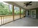 Spacious screened-in porch with wood trim and peaceful outdoor views at 200 Whistlers Cv, Louisburg, NC 27549