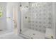 Bathroom with a glass-enclosed shower featuring a patterned tile wall at 200 Whistlers Cv, Louisburg, NC 27549