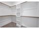 Walk-in closet with shelving at 200 Whistlers Cv, Louisburg, NC 27549