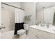 Bathroom featuring a shower/tub combo, toilet, and single sink vanity at 204 Towne Ridge Ln, Chapel Hill, NC 27516