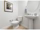 Powder room featuring a toilet and single sink pedestal at 204 Towne Ridge Ln, Chapel Hill, NC 27516