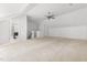 Large bonus room with adjoining bathroom and neutral colored carpet at 204 Towne Ridge Ln, Chapel Hill, NC 27516