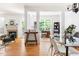 Bright dining area showcasing a fireplace and seamless transition to the office and living spaces at 204 Towne Ridge Ln, Chapel Hill, NC 27516