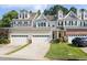 Charming townhouse with attached garages, well-maintained lawn, and inviting curb appeal in a desirable neighborhood at 204 Towne Ridge Ln, Chapel Hill, NC 27516