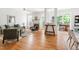 Open-concept living room with stylish decor, hardwood floors, and seamless transition to dining area at 204 Towne Ridge Ln, Chapel Hill, NC 27516