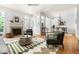 Comfortable living room featuring a fireplace, hardwood floors, and an open layout to the dining area at 204 Towne Ridge Ln, Chapel Hill, NC 27516
