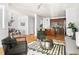 Cozy living room featuring hardwood floors, stylish furniture, and open concept design with kitchen at 204 Towne Ridge Ln, Chapel Hill, NC 27516