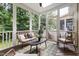 Screened-in porch with nice furniture, ready for relaxing and enjoying the weather at 204 Towne Ridge Ln, Chapel Hill, NC 27516