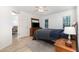 Bedroom features ceiling fan, wood furniture, laminate flooring and access to bathroom at 204 Valley Ct, Selma, NC 27576