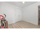 Clean bedroom with light wood flooring, closet and white walls at 204 Valley Ct, Selma, NC 27576