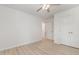 This empty bedroom features a ceiling fan, laminate floors, window, and a closet at 204 Valley Ct, Selma, NC 27576