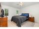 Bedroom featuring ceiling fan, wood furniture and laminate flooring at 204 Valley Ct, Selma, NC 27576