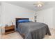 Bedroom featuring ceiling fan, wood furniture and laminate flooring at 204 Valley Ct, Selma, NC 27576