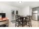Cozy dining area with a dark wood table and chairs, and French doors leading outside at 204 Valley Ct, Selma, NC 27576