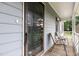 Inviting covered front porch with rocking chairs, perfect for enjoying the outdoors at 204 Valley Ct, Selma, NC 27576