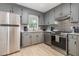 The updated kitchen features stainless appliances, granite countertops and stylish backsplash at 204 Valley Ct, Selma, NC 27576