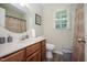 Cozy bathroom with a sink, toilet, and shower with a curtain at 205 Cedar Dr, Zebulon, NC 27597