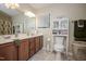 Bright bathroom featuring a double sink vanity, toilet with storage, and neutral color scheme at 205 Cedar Dr, Zebulon, NC 27597