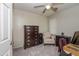 Well-lit bedroom with a dresser, chair, and a window at 205 Cedar Dr, Zebulon, NC 27597