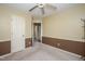 Bright bedroom with carpeting, ceiling fan, neutral paint and spacious closet at 205 Cedar Dr, Zebulon, NC 27597