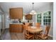 Cozy dining area with wood table and chairs, bright natural light, creating a warm atmosphere at 205 Cedar Dr, Zebulon, NC 27597